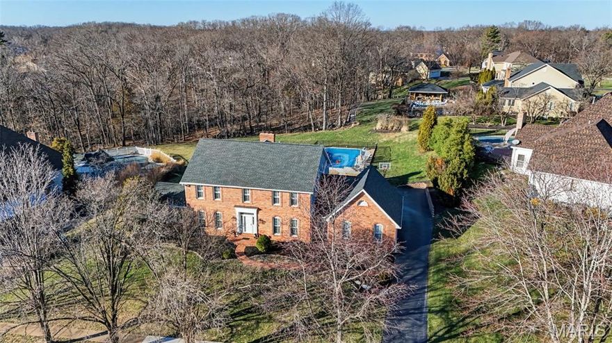 Welcome to this stunning brick 2-story residence in the sought-after Wilson Farm Estates neighborhood, located within the highly regarded Rockwood School District. Blending timeless architecture with elevated comfort, this beautiful home offers an exceptional lifestyle with refined living spaces and upscale features throughout. Inside, hardwood floors extend across the main living areas, creating warmth and elegance from the moment you step through the door. The thoughtfully designed floor plan offers four spacious bedrooms and four and a half bathrooms, providing plenty of room for everyday living, guests, and entertaining. Throughout the home, three fireplaces add charm and a cozy ambiance to multiple gathering spaces. The home is designed to bring people together while still offering peaceful retreats. A bright and inviting three-season room provides the perfect setting for morning coffee, quiet evenings, or enjoying views of the back and side yard while staying comfortably indoors. The finished lower level expands the home’s versatility, offering the ideal space for a recreation room, media lounge, fitness area, or additional entertaining space. Outdoors, the property transforms into a private retreat. The beautifully maintained backyard features a private in-ground pool, creating a resort-style atmosphere perfect for relaxing weekends, summer gatherings, or evening swims. Surrounded by mature landscaping, the setting provides both beauty and privacy. With classic brick construction, spacious living areas, and luxury amenities inside and out, this exceptional property offers the perfect blend of sophistication, comfort, and everyday livability in one of the area’s most desirable communities.