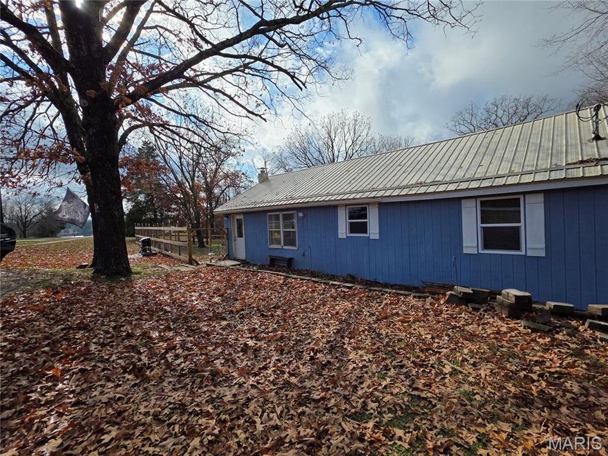 Check out this rare find! This 3 bed, 2 bath home is located on over 2 acres inside Houston city limits! Lots of upgrades to this 1940's charmer. New windows, siding, flooring and HVAC system to name a few! Newly remodeled bathroom, updated kitchen with butcher block countertops and apron sink. Circular drive and partial basement. A newly installed 6ft wood rail and woven wire fence offers a great enclosure offers a great enclosure for pets. Plenty of space for outdoor gatherings, gardening or a fruit orchard, several peach trees have been planted. Lots of possibilities with this property!
