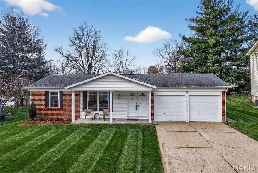 Beautiful home on quiet cul-de-sac street in Spencer Creek West subdivision. This home features a bright wide open floor plan with updated luxury vinyl plank flooring, modern lighting, and fresh neutral finishes throughout. The stunning kitchen offers custom cabinetry, solid surface countertops and backsplash, new stainless steel appliances, large center island, and opens seamlessly into the spacious living and dining areas that are perfect for everyday living and entertaining. The floor-to-ceiling brick fireplace creates a warm focal point in the main living space. Updated bathrooms feature new vanities, fixtures, hardware and lighting. The primary suite offers his and hers closets, beautifully remodeled bathroom and new carpeting.  Enjoy the oversized backyard with plenty of room to play or relax and entertain on the patio. Additional features include new interior doors, trim, lighting, hardware, flooring and fresh paint throughout. Covered porch and attached two-car garage and refreshed exterior curb appeal. Conveniently located near subdivision parks, trails, restaurants and shopping.