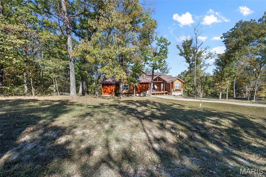 Discover a spacious, custom-built home tucked inside the scenic, gated Grayhawk Community. The main level offers three comfortable bedrooms, including a primary suite with its own private bath. A handcrafted staircase—built from wood harvested directly from the property—leads to a versatile fourth bedroom or bonus room.
Step outside to a brand-new deck overlooking peaceful natural surroundings, perfect for relaxing or entertaining. The walk-out basement provides even more room to expand your living space.
Ownership includes full access to nearly 200 acres of community amenities, including stocked lakes, an in-ground pool, hiking trails, and more. All of this is just minutes from historic Ste. Genevieve, known for its festivals, restaurants, shops, and small-town charm.
The home is being sold as-is, though the current owner is completing finishing touches. This is a rare chance to own a truly unique custom home in a one-of-a-kind setting. Schedule your private tour today!