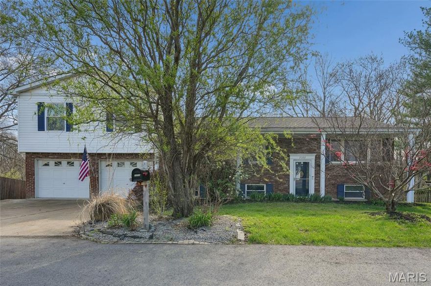 Bright Open Living!
Sun-filled spaces, flexible living, and a peaceful half-acre setting make this 4 bed, 2.5 bath home truly special. From the inviting entry, hardwood floors flow throughout the main level into an updated kitchen featuring custom cabinetry with pullouts, tile backsplash, and stainless appliances—all included. The breakfast room opens to an updated deck overlooking a lush, tree-lined backyard.

The main level hosts the primary bedroom—its own private retreat—with a spacious vaulted bath just across the hall offering dual vanities, soaking tub, and separate shower, along with convenient main floor laundry. Just down the hall and a few steps up, an expansive bonus room impresses with hardwood floors, gas fireplace, wet bar, half bath, and dramatic floor-to-ceiling windows capturing serene views.

The walkout lower level includes three additional bedrooms, a full bath, and an unfinished storage area with access to the patio and backyard. A 2-car garage, new roof (Jan 2026), and gas conversion complete this exceptional home—offering space, comfort, and a beautiful natural setting.