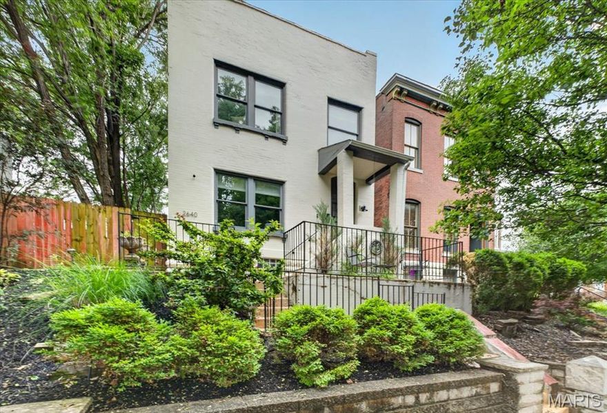 Welcome to this beautifully updated 3-bedroom, 2.5-bath home that checks every box in Fox Park. The open floor plan and oversized windows flood the home with natural light, showcasing rich hardwood floors throughout. The heart of the home is a chef-inspired kitchen anchored by a large waterfall island and wine refrigerator — perfect for entertaining or everyday living. Retreat to your second floor private en-suite primary bedroom accompanied by two additional bed rooms or possible office space. Step outside to a lovely deck overlooking a rare double lot with a serene, park-like backyard — a true urban oasis ideal for relaxing, gardening, or entertaining. Parking is never a concern with a 2-car garage plus 2 additional private parking spots — a coveted convenience in today's market. This move-in ready gem delivers the perfect blend of style, space, and functionality.