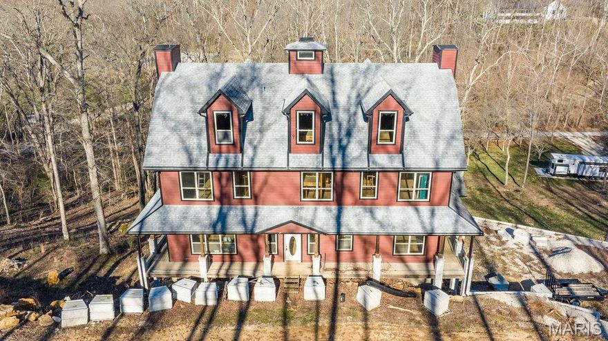 Stunning Custom Home Opportunity in Wildwood

Nestled in a picturesque, wooded subdivision in Wildwood, this exceptional property offers privacy and convenience—just minutes from shops and restaurants, yet set on 3, private acres with over 1 acre of level pasture, a rare find in the area. This ~6500 sq. ft. home is ready for your personal touch! With four stories, the interior is yours to finish and design to your exact preferences. The fourth floor is also framed for two spacious bedrooms, a large common area, a bathroom, and a unique lookout tower—perfect as a play space for kids or an inspiring retreat for teens.

Boasting six bedrooms, each with its own walk-in closet, seven full bathrooms, and one half-bath, this home provides abundant space for family and guests. Extensive hardscaping features retaining walls at both the front and back of the property (front wall currently under contract for completion). The lot has been thoughtfully cleared of dead trees and brush. Major infrastructure is complete: septic system, plumbing, electrical, geothermal, and HVAC (HVAC installed on the fourth floor). This residence is ready for you to add the finishing touches and create your dream home! A MUST SEE! Current home plans and bids available on request. Selling AS-IS