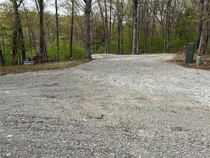 Beautiful secluded lot, just 5 minutes from Mark Twain Lake. Only 2.6 miles from Ray Behren's boat ramp. This lot is fully wooded, with campsite already built, featuring public water, buried electric and fiber optic and septic being installed as we speak. Privately located on less than 1 mile of gravel and backing up to Corps of Engineers property. This is the ultimate spot for evening enjoyment around the campfire without the hustle and bustle of other campers! You just don't find many comparable spots around Mark Twain Lake. Make that call today, to take advantage of this opportunity!