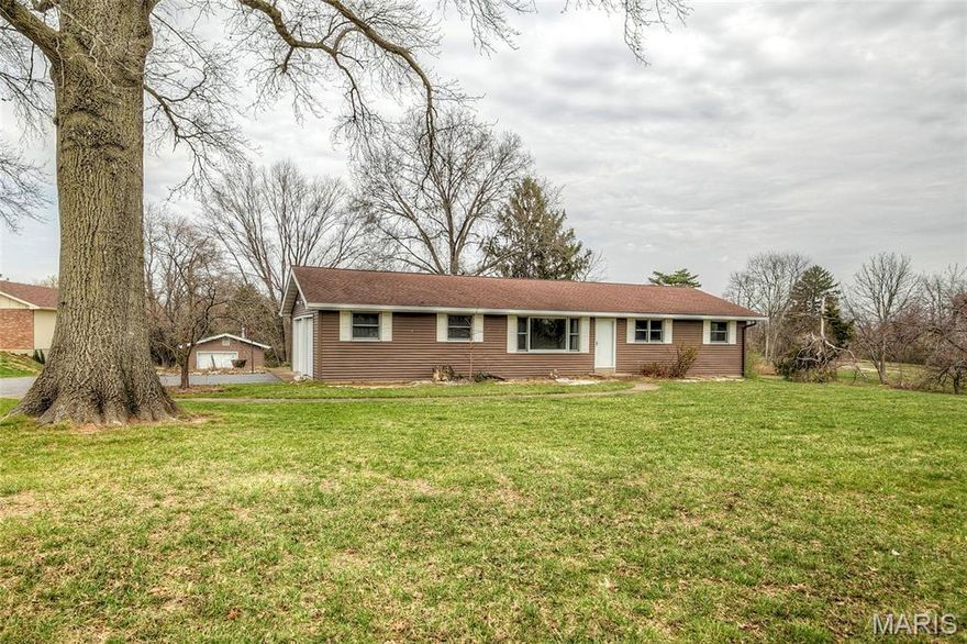 Welcome to 17370 Old Jamestown Road!  Come enjoy the Old Jamestown Area's "country" living near all suburban conveniences.  First time this home has been available for sale, ever!  This clean, bright and solidly built 3BR/2BA home has a finished LL, 2-Car side entry garage PLUS a 1-car oversized detached garage -- nearly 1,000 square feet of garage space here!  You can breathe a little and enjoy your two-acre slice of land here.  Newer hardwood flooring throughout main level (2024).  Spacious Family Room has beautiful ceiling beams, hand-hewn by the builder, plus a wall display niche and peg & plank hardwood flooring.  Pretty kitchen has been updated with quartz counters, stainless steel appliances, some decorative open shelving, plus newer ceiling fan.  Primary bedroom features double closets; two secondary bedrooms and renovated hall bath w/linen closet round out the main level.  Heading downstairs you'll find plenty of finished space with vintage charm, including a bar and another full bath.  Roughly half the finished space has been newly carpeted, and the remaining is in vinyl -- perfect for craft area.  Large covered back patio.  Great views -- rolling farmland out front and trees and countryside out back.  See this one today!