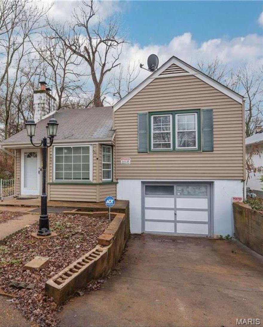 Discover the perfect blend of space and unique architectural character in this stunning 4-bedroom, 3-bathroom retreat tucked away on a quiet Ferguson cul-de-sac. The heart of the home features an expansive living and family room anchored by a cozy fireplace, ideal for large gatherings or quiet evenings. The bright, eat-in kitchen offers plenty of room for the home chef to work while staying connected to the conversation. One of the standout features is the upper-level loft bedroom, which boasts a private half-bath—creating a perfect sanctuary for a primary suite, guest quarters, or a secluded home office. Car enthusiasts and hobbyists will fall in love with the oversized tandem garage, offering incredible depth for two vehicles, a workshop, or a home gym. With minimum TLC this home is move in ready and waiting for a new owner. Located just minutes from the award-winning Ferguson Farmers Market, local breweries, and scenic parks, this home combines privacy with community convenience.
