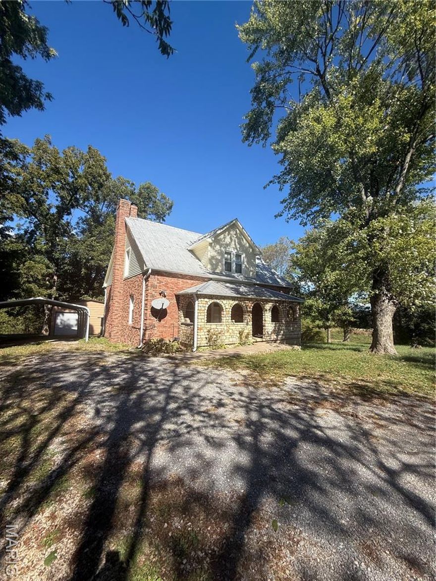 Looking to live in the country but also be within 10 minutes of town? Located in the Jackson school district, you’ll find a fruiting pear tree along with additional mature pecan trees on the property. This home sits just off a gravel road minutes from Gordonville, and less than 10 minutes from both Cape Girardeau and Jackson.  All new flooring on the main level just installed in the last quarter of 2025. Main level laundry off the back of the home which could also make for a beautiful pantry/ stock area.  Primary bedroom with private bath are on the main level with ample closet space, tall ceilings and plenty of room for large bedroom furniture.  The second floor has two additional large bedrooms (each with two closets) and a bonus play room or possible small office overlooking the front yard with amazing light. 7.54 acres on recent survey with a stocked pond. Unfinished basement. Large outbuilding and covered parking.