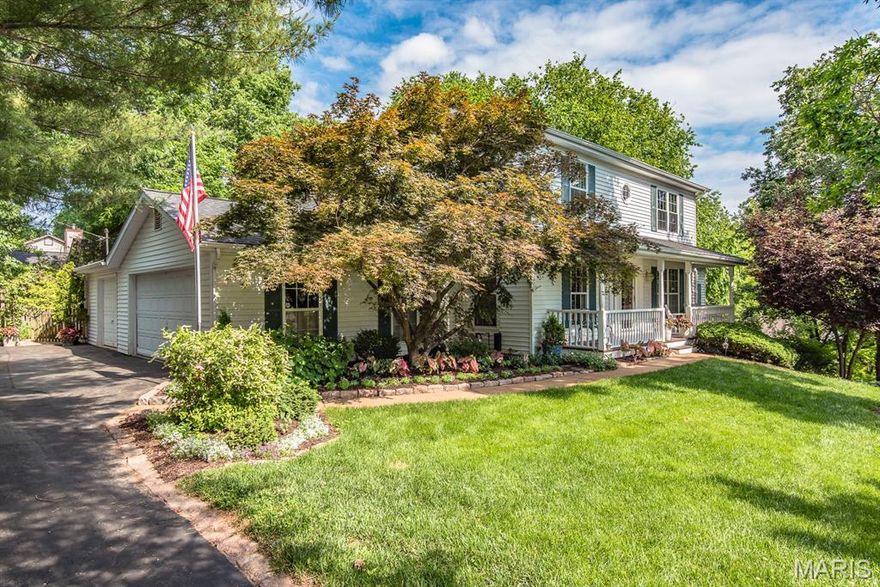 Escape to your quintessential custom, dream home with 4 bedrooms, 3.5 baths and 3 car garage tucked away in upper Sugar Creek.  Expansive covered front porch and lovely landscaping are just the beginning.  Transcend time and step back into the peace and tranquillity of a home filled with wonderfully updated features and classic charm.  Center hall Colonial with a large, elegant dining room for those who love to entertain family and friends.  Updated kitchen opens to a large breakfast - family room combination with 9' ceilings provides ideal flow for everyday life and parties alike. Convenient, large main floor laundry is a plus.  Wonderful vaulted office with bookshelves and beautiful Palladian window that enhances your work space. Around the corner is a screened in porch that seeks to bring the beauty of the the outdoors in along with a covered back porch that beckons nature and coffee to coexist.  Upstairs you will find, not one, but two primary en-suites.  The first of which offers a large, grand en-suite with seating area and huge walk-in closet.  The 2nd primary offers the same but on a smaller scale.  Two additional bedrooms and another full bath complete the upper level.  The lower level boast a huge recreational area, storage room and an additional awesome office with walk-out to a beautifully fenced in yard.  Stunning gardens, exceptional landscaping, covered porches and two serene patios that beckon you home.  Come, your new life awaits.