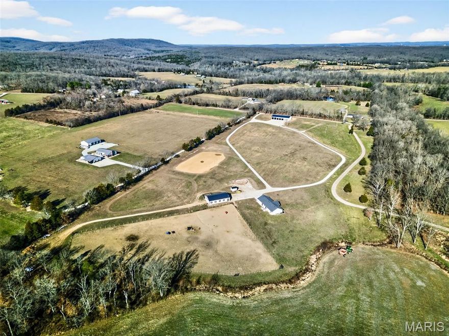 Equestrian Paradise on 15.5 Acres! Investment grade open land for your possible future development plans. Discover your ideal country retreat, custom-built less than two years ago for those passionate about horses and rural living. This remarkable property comes complete with an all equipped heated horse barn, which includes 7 (12' x 12') stalls with 4'x 4' windows. It also includes electric fencing throughout and a dedicated riding arena—everything needed for your equine companions. Stretching over rolling pastures with sweeping, scenic vistas, the peaceful setting is only a short drive from town conveniences.
This adorable 3 bedroom, 2 bathroom ranch home features an inviting open floor plan, a warm fireplace, a spacious kitchen island, ss appliances, granite countertops and real engineered hardwood flooring, all centered around a primary suite designed for relaxation. Storage is ample, with an attached 30x30 garage. Whether you’re an avid equestrian or simply appreciate expansive views and refined country living, this property offers the complete package! In addition to this property, *Parcel #14-30-07-00-000-0008.07 is also available for an additional $465,000. It comes with 3.26 acres and and an impressive, heated 5,000-square-foot workshop. It’s perfect for RVs, tractors, trailers, and equipment of all kinds. Call for more details!