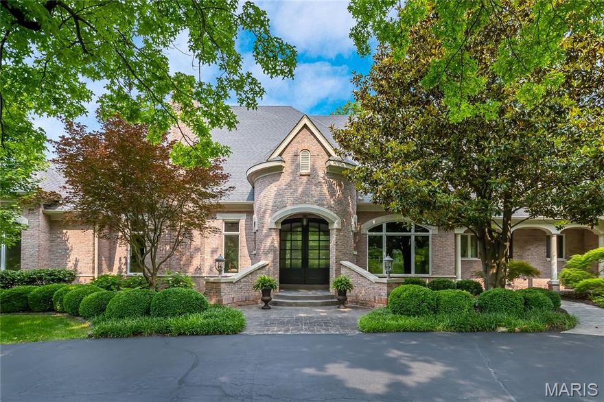 Nestled on an exclusive gated lane, this exceptional DeShetler-built estate has been extensively reimagined to meet the highest standards of todays lifestyle. Set on over an acre of meticulously landscaped grounds, the home offers more than 8,900 sq ft of refined living space. A grand marble foyer opens to wide-plank French oak flooring, soaring 12-foot ceilings, intricate moldings, and elegant arched passageways. The richly appointed study features bespoke paneling and built-ins, while the formal dining room is perfect for sophisticated entertaining. The expansive great room impresses with a beamed cathedral ceiling, fireplace, and Palladian windows. Designed by Marc-Christian, the kitchen includes Wolf and Sub-Zero appliances, a sculptural marble hood, double-stacked countertops, Visual Comfort lighting, a butler’s pantry, and wet bar. The hearth room and sunlit breakfast room offer cozy gathering spaces. The main-level primary suite boasts a coffered ceiling, marble fireplace, couture closet with laundry, and spa-inspired marble bath with freestanding tub. Two additional en-suites complete the main level, with a fourth bedroom and large bonus room upstairs. The walk-out lower level offers a full bar, game room, fitness studio, media room, fifth bedroom, and full bath. Outdoors, enjoy a free-form saltwater pool, outdoor kitchen, and terrace. An over-sized four-car garage completes this premier estate in a prestigious gated enclave.