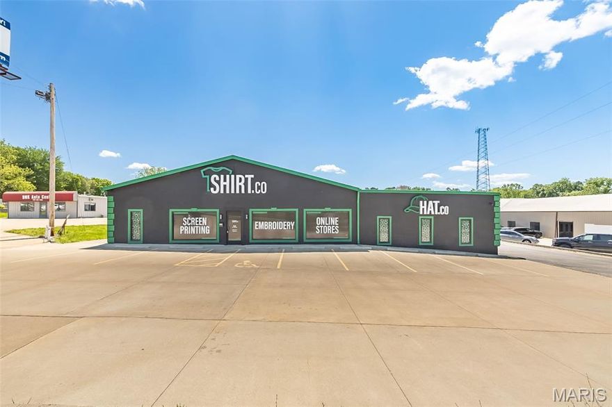 Excellent location, great highway visibility, and quick and easy access to Hwy 364. Commercial, Retail, or Light Industrial stand alone building with over 15,000 SF on nearly an acre. Approximately 7,500 SF of office, showroom, meeting room space that is climate controlled, 5,000 SF of warehouse space is climate controlled and another 2,500 SF of warehouse space is heated. Building has 4 drive-in doors and a loading dock, 4 bathrooms, and approximately 30 parking spaces. Property is ADA Accessible. Zoned C-3.