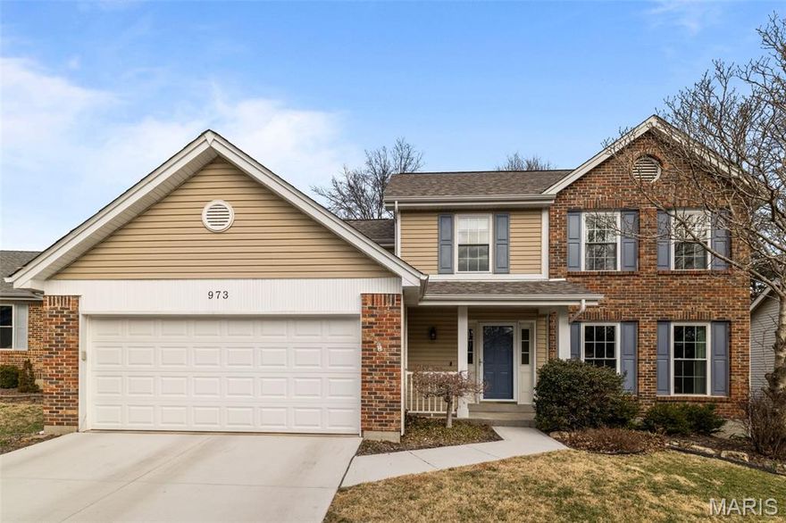 Welcome to this well-maintained and updated 2-story in a great Ballwin location! You'll have wonderful curb appeal with a landscaped front yard, brick details and a covered front porch leading you inside. The foyer opens to the bright living room with gleaming hardwood floors that continue into the dining and family rooms. Thoughtful finishing touches in every space make this house a home: crown molding, chair rails, millwork, and stylish lighting. You'll love gathering with friends and family in the beautiful kitchen, featuring brand new stainless steel oven/range, microwave and dishwasher, plus a timeless granite countertop, 42" cabinets, tile backsplash, under-cabinet lighting, planning desk, and tile floors that continue into the breakfast room. The family room has a cozy woodburning fireplace with floor-to-ceiling stone surround. A half bath completes the space. Upstairs, the primary bedroom has a vaulted, beamed ceiling, chair rail and millwork, walk-in closet, and en-suite bathroom. Three more spacious bedrooms and another full bath round out the second floor. The finished basement adds a large rec room and game area, as well as unfinished storage space with built-in shelving and a work bench w/peg board. A newer roof ('24), garage door ('24), driveway ('25), and Nest thermostat give peace of mind. Enjoy the warmer weather on the charming paver patio overlooking the beautifully landscaped backyard, shaded by trees. In a great community, with access to Klamberg Trail leading to Bluebird Park, nearby Rockwood schools and Ballwin Pointe community center, plus all of the shopping and restaurants along Manchester, this home is just moments from everything you need!