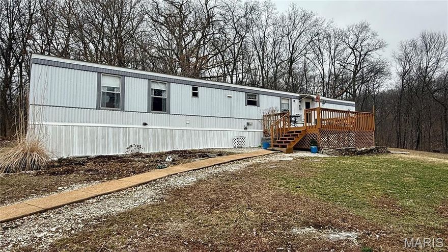 This well-maintained single-wide manufactured home offers 2 bedrooms and 2 full baths, perfectly situated on 7.1 m/l peaceful acres. The property includes a one-car detached garage with an attached side carport, providing plenty of covered parking and storage space. In addition, you'll find several small outbuildings ideal for tools, equipment, or hobby use, along with a separate carport for extra vehicle or recreational storage. With open space and versatile improvements, this property offers privacy, functionality, and room to enjoy country living at its best.
Property is being sold "as is", inspections for buyers knowlege only.