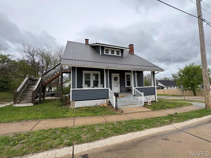 Siding, windows, roof gutters and HV/AC all new in 2024. Kitchen, new paint and carpet in 2022. Step into the character of this 1.5-story home in the heart of Warrenton, where original details meet comfortable, everyday living. Built in 1930, this home offers 1,762 sq ft filled with warmth, from the inviting living spaces to the cozy fireplace that naturally draws everyone in. Arched openings, built-in shelving, and classic trim details give the home personality you just don’t find in newer construction.

The kitchen offers ample cabinet space and room for a full dining setup, while large windows throughout the home bring in natural light. The full unfinished basement provides generous storage or future finishing potential. Outside, enjoy a covered front porch that feels like it belongs in a slower, simpler time, plus additional exterior access and a layout that offers flexibility for everyday living. Conveniently located near local shops, dining, and schools, this home blends character, function, and location in one solid package.