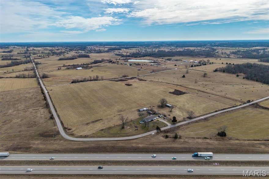 Discover the perfect blend of open space and opportunity with this 2.43-acre parcel ideally situated alongside 25 acres of picturesque hay field currently offered for sale. Whether you’re looking to build your dream home, create a hobby farm, or invest in land with expansion potential, this property delivers flexibility and value. The existing outbuildings provide a strong head start for agricultural use, recreational storage, or future improvements. With utilities readily accessible, development is streamlined while still offering the peace and space of country living. This parcel offers the rare opportunity to own a manageable homesite while having additional acreage available next door—perfect for those who want room to grow without sacrificing convenience. Whether you envision a private homestead, weekend retreat, or small-scale farming operation, this property is ready to bring your vision to life.