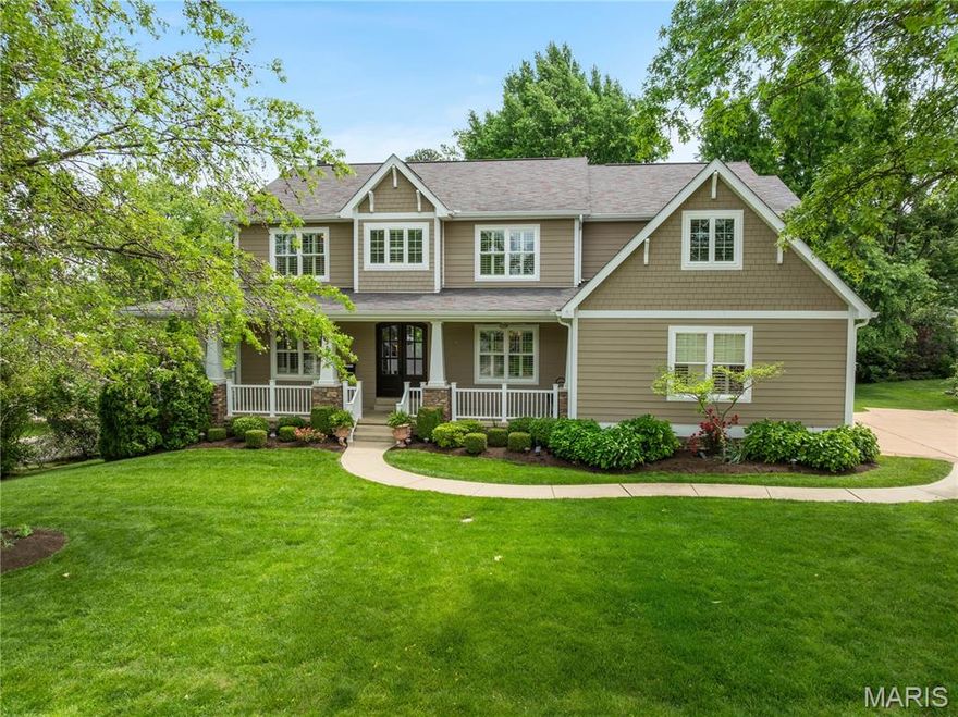 Walkable to downtown Kirkwood, this newer construction Craftsman home blends timeless style with modern convenience. Sun-filled rooms showcase tall windows, hardwood floors, crown molding and louvered shutters. The living room centers on a stone fireplace and opens through wide sliders to a rear patio. A formal dining room adjoins a dry bar, while across the hall a versatile den/office opens to a wrap-around front porch. The flow continues to an eat-in kitchen with white cabinetry, granite counters, under-cabinet lighting and a generous island, plus a walk-in pantry & mudroom. Upstairs, the airy primary suite offers a walk-in closet and bonus room perfect for office, sitting room or extra wardrobe, while three additional bedrooms include one en-suite and a Jack-and-Jill. A convenient laundry room is nearby. The finished lower level extends the living space with large windows, a rec room & kitchenette. The professionally landscaped yard & patios are an oasis. Whole house generator.