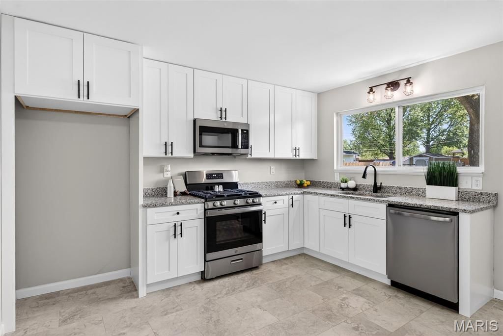 Photo of 390 Versailles Drive, Florissant, MO 63031 (MLS # 26024444)