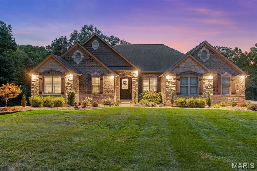 Stunning all-brick custom home on a 4+ acre lot in Wentzville - a MUST SEE! Unbeatable location away from the hustle & bustle yet only a few miles from shops & restaurants! Enjoy COMPLETE SECLUSION. The long driveway creates a grand entry to the estate. This Impeccably maintained home offers over 3,300 sqft of living space. Upon entering, you will be met w/ stunning hardwood floors & tray ceilings w/ wood inlay accented by crown-molding. The Formal dining displays crisp white millwork + box paneling & elegant fixtures. 9' ceilings transition to 11' ceilings in Great Room & Kitchen. The Kitchen is a chef's dream! Featuring a dramatic stone arch, quartzite countertops, double oven & ss appliances! Command center situated off of the kitchen leading to a walk-in pantry. The Great Room is framed by expansive windows w/ retractable blinds, custom built-ins & a striking stone fireplace (gas). 19'x15' Primary Bedroom w/ large window alcove overlooking the private backyard. Primary bath incl his & her vanities, a jacuzzi tub, free standing shower, & double-sided walk-in closet w custom closet system! 2 Secondary Bedroom Suites w/ full baths. Large home office that could be converted to a 4th bed. Pwdr room across from butler pantry & wine fridge. Drop zone off of garage entry. Beautifully re-designed laundry room w/ cabinetry & sink. STUNNING BACK PATIO! Gas Fireplace, Exterior Lighting, Built in Gas Grill & Prep Station. See RE Agent for remaining list of features. RARE OPPORTUNITY!