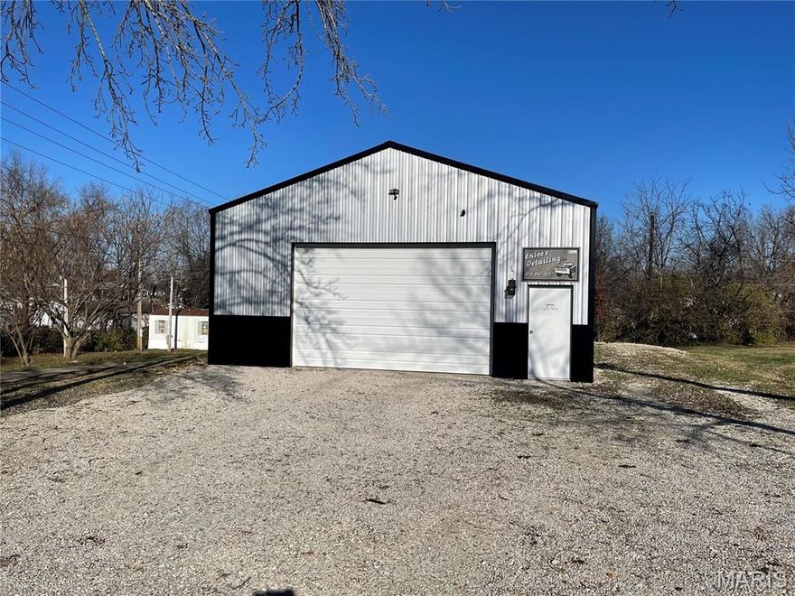 Double lot on the corner of Center and Park Streets.  Very nice, well maintained 40 X 30 metal garage that has concrete floor with a drain, 110 and 220 electric, insulated, 10X16 garage door, walk door, 2 mini splits for heat and air, kitchenette, bath with walk-in shower that needs finished, and 16" center walls.  This property is currently zoned residential and is being used as a car detailing shop on a conditional use permit.  This permit WILL NOT transfer to the new owner.  Should the new owner want to do something commercial, he/she will have to contact the City of Salem and go through the process.  This is an awesome location and prefect for someone wanting to build a small home on the vacant lot and have the awesome garage on the other lot.