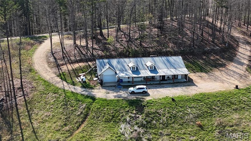 Located between Salem and Eminence is this Ozark hilltop beauty on 26 peaceful and secluded acres just minutes from Echo Bluff State Park, Sinking Creek, Current River State Park, Devils Well and Alley Springs, just to name a few. This home faces east and is nestled into the side of an Ozark hilltop, offering breathtaking views and picture-perfect sunrises. This beautiful retreat features a large open floor plan with 3 large bedrooms, 3 bathrooms, a large living room, and an open-concept kitchen/dining area with skylights for natural light throughout. Recent updates include new plumbing, new luxury waterproof vinyl flooring, a new heating and air conditioning system, a new water heater (two hot water heaters total), and the primary bedroom bath boasts a new tile walk-in shower. Ample wildlife including wild horses are often seen roaming the forests. Oh, sorry, I forgot to tell you about the bears. Don't delay. Call today to see this amazing property right in the heart of our beautiful Missouri Ozarks.