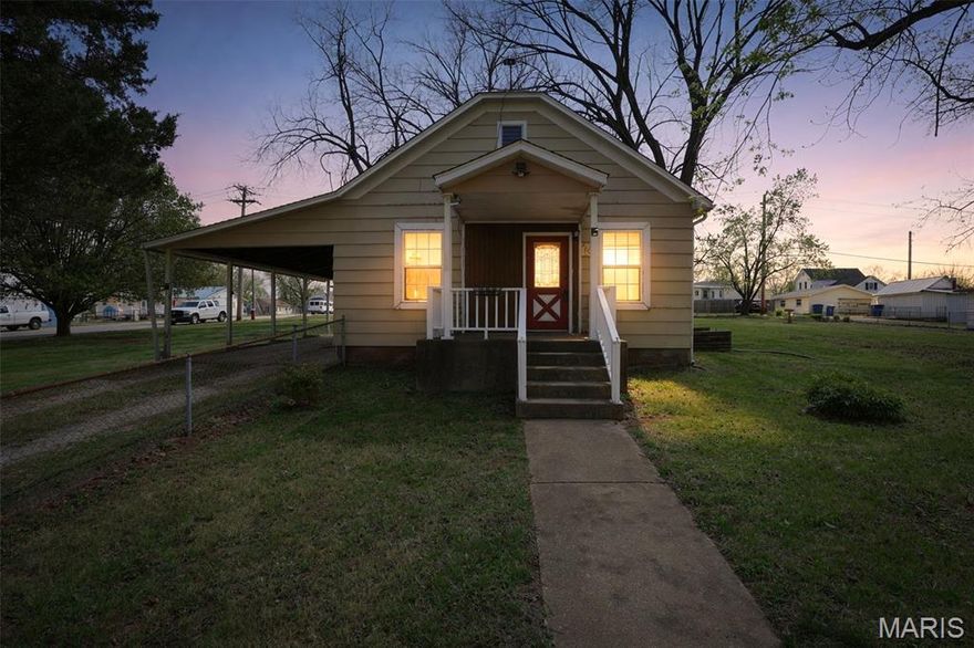 Completely refreshed and move-in ready, this charming bungalow-style home sits on a spacious corner lot spanning three parcels, offering a rare combination of open space and mature shade trees. Recent updates provide peace of mind, including a new HVAC system, new roof, updated windows, repaired floor joists, and a newly installed HD TV antenna providing access to several free over-the-air HD channels.

Inside, you’ll find a comfortable and functional layout with updated finishes and a welcoming feel throughout. Outside, the property truly shines with its generous yard space, alley access, and unique features that set it apart.

A standout feature is the historic carriage house, complete with a large covered porch and decorative antique water pump, adding character and versatility for storage, workshop space, or future possibilities.

With its combination of updates, usable land, and distinctive charm, this property offers exceptional value at its price point. Whether you're looking for a primary residence or a property with extra space and potential, this one is well worth a look.