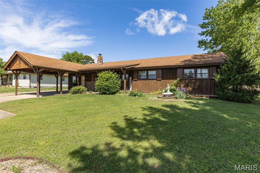 Situated on 1.49 acres, this unique property offers a rare combination of space, versatility, and functionality. The 1,400 sq ft home features convenient one-level living and showcases beautiful custom millwork with timeless character throughout. All appliances stay, septic system installed in 2025, new survey and recently serviced chimney provide added peace of mind. Also included is a turn-key charming cabin, featuring a fully furnished kitchen, living area, bedroom, full bath and new LVP flooring throughout.  All cabin appliances stay as well, making it ready for guests, extended family, private office use, or potential rental income. The large detached garage provides ample storage, workshop space, covered parking, and ample room for toys. Bonus! Stocked pond is loaded with bass, crappie, and bluegill, offering outstanding recreational appeal right outside your door. This peaceful compound offers Acreage, water, one-level living, and dual-living flexibility, all within the Farmington area. What more could you ask for?