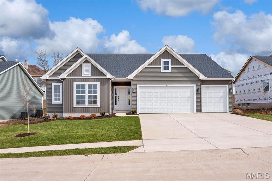 Discover the Canterbury at Willow Grove! This beautifully designed ranch is a homeowner favorite is move in ready, offering 3 bedrooms, 2 baths, and a spacious 3-car garage. With 9’ ceilings, a vaulted great room, and a gas fireplace with a stylish shiplap surround, the open floor plan feels bright, airy, and welcoming. The gourmet kitchen is perfect for entertaining, featuring a large island, quartz countertops, 42” cabinets, stainless steel appliances, a walk-in pantry, and elegant pendant lighting. The deluxe owner’s suite provides a peaceful retreat with double-door entry, dual vanities, a walk-in shower with marble surround and bench, and a spacious walk-in closet. Designer touches throughout include luxury vinyl tile, laminate wood flooring, and matte black fixtures for a modern yet timeless aesthetic. Located on Landyn Court in Dardenne Prairie, this home blends sophisticated style with everyday comfort—ideal for today’s lifestyle. Contact us today for more information or to schedule your private tour! Photos and virtual tour may depict a similar home; finishes may vary.