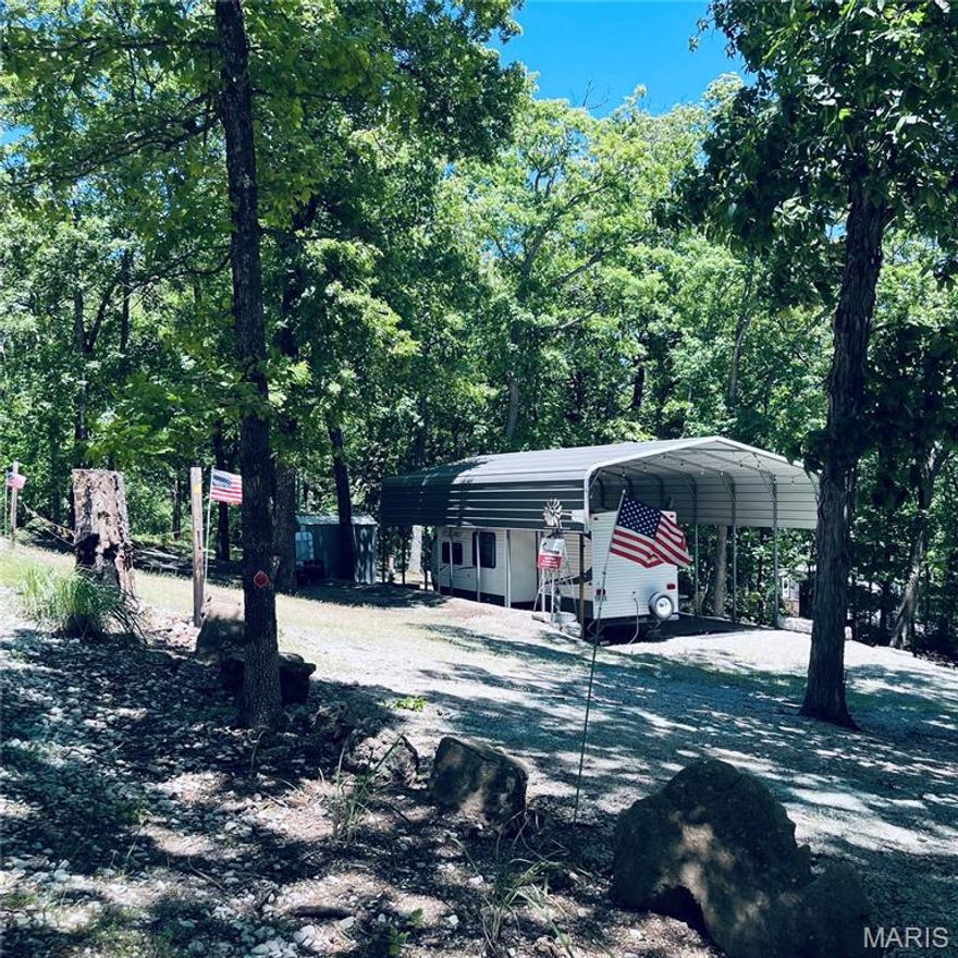 Perfect Retreat or Future Dream Home – Your Choice!

Whether you're looking for a place to build your dream home and live like you're on vacation every day, or seeking a ready-to-go getaway, this is the property for you! Situated on three lots with paved road access and easy entry from the gate, this property offers versatility and convenience.

The lots are not DNR restricted, allowing for the construction of a full residence with the proper permits. Currently, the property features two covered campers (one sleeps 9 and the other sleeps 6) plus a dry cabin—perfect for enjoying your weekends and extended stays.

Key features include:

200-amp electric service with 3 sub panels

Two additional electric hookups for campers

Dusk-to-dawn lights for added security

Water totes and porta potties included

Convenient location near the front gate and community amenities

Enjoy access to the 400-acre GC Lake, ideal for a wide range of water sports. The community offers a pool, recreational hall, two playgrounds, smaller lakes for fishing and non-motorized boating, plus year-round activities organized by property owner groups, including poker runs, holiday parties, movie nights for kids, and more.

Note: The composite picnic table and garden shed by the cabin are NOT included in the sale.

This is an excellent opportunity to have the best of both worlds—create your ideal permanent residence or have a convenient, fun-filled retreat just steps from everything you need!