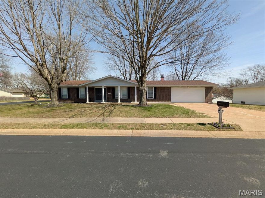 Spacious brick and vinyl ranch on a large corner lot in a great location and subdivision. This house was updated in 2023 with new white shaker cabs in kitchen, newer countertops and stainless appliances. Nice sized breakfast room, large formal living room, family room with wood burning fireplace and newer slider out to huge patio in back, newer roof and water heater (per previous seller), rec & 2nd family room in LL, and 2 car oversized garage with rear drive-through door perfect for a workshop or riding mower. Both bathrooms were updated in 2023 (walk in shower in one bathroom and tub in the other bathroom), along with newer flooring at that time. This house does need some cosmetics and a little TLC, but the potential is endless with 1621 sq ft on main floor and the additional 1000 sq ft in the LL.