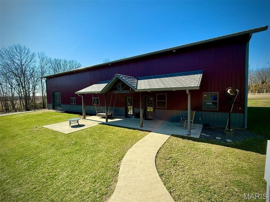 Welcome to a one-of-a-kind property offering the perfect blend of comfort, recreation, and opportunity. Whether you're searching for your forever home, a live-work setup, or even a luxury hunting retreat, this exceptional 3-bedroom, 4-bathroom residence just outside Shelbina, Missouri, delivers.

With approximately 2,100 sq ft of beautifully finished living space, the home welcomes you with warm wood finishes and an inviting open-concept design. The stunning great room flows seamlessly into the kitchen, where a spacious island creates the perfect gathering place for family and friends. Overlooking it all, a loft adds both character and functionality, enhancing the home’s open yet cozy feel.
The main floor features a spacious and comfortable master suite complete with a private bath and walk-in closet. A versatile utility room offers potential for a home office or additional bedroom, giving you flexibility to fit your needs.

Upstairs, the expansive loft serves as an ideal entertainment area, game room, or additional living space. Two generously sized bedrooms and a shared bathroom complete the upper level, providing plenty of room for family or guests.

And then—something truly special!  Attached to the home is an incredible 3,200 sq ft indoor basketball/pickleball gym, complete with its own efficient HVAC system. Featuring sports vinyl flooring, competition-grade hoops, soaring ceilings, and excellent lighting, this space is built for year-round enjoyment. Two full glass garage doors—one opening to the outdoors and another connecting directly to the living area—create a seamless indoor/outdoor entertainment experience.  Not into sports? This space easily transforms into a workshop, business space, vehicle storage, car detailing bay, or even an in-home daycare facility—the possibilities are endless.

Outside, a 60’x35’ metal building with three garage doors and partial concrete flooring provides ample room for equipment, storage, or a full-scale shop. The 4± acres have been thoughtfully utilized for gardening and an orchard, both with access to water, making them ideal for hobby farming or self-sufficiency.  To top it all off, a beautifully designed treehouse adds charm and fun for all ages.

Located just minutes from town, this rare property offers the privacy of country living with convenient access to amenities.  For the outdoors lover, multiple hunting and fishing opportunities are close by, including Arrow-Wood Nature Area, Salt River, Shelbina Lake, and Mark Twain Lake!