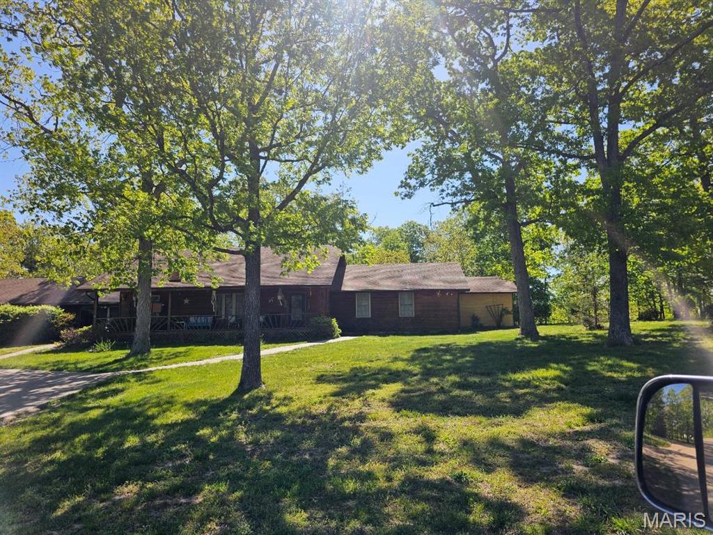 View of front of property featuring covered porch