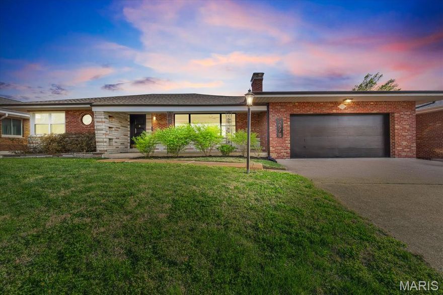 Every square foot of this mid-century modern Northampton home is a vibe—where timeless design meets unbeatable city living. Step onto the massive front porch and into an open-concept layout featuring clean lines, a striking picture window, and a retro-inspired fireplace that anchors the main living space. Fully renovated in 2021, the kitchen blends modern updates with classic MCM style—think flat-paneled cabinetry, crisp geometry, and a fresh, functional layout. Three spacious bedrooms and an updated full bath complete the main level. The finished lower level is made for entertaining, with a second fireplace, original built-in bench seating, custom cabinetry, and a MCM wet bar that was made to serve up a Manhattan. The unfinished area consists of a laundry room, lots of storage space, and even a bomb shelter! Out back, you’ll find a thoughtfully designed outdoor space featuring an expansive patio and a fully organic, raised garden—perfect for the city gardener ready to grow fresh food at home. Rare city perks include a private driveway and oversized 2-car attached garage! Beyond the home itself, enjoy incredible conveniences with local favorites like Knead Bakery, ramen at Menya Rui, and crafted cocktails at The Famous Bar just minutes away. Prefer to explore on two wheels? You’re an easy bike ride to neighborhood staples like The Golden Hoosier, Bud's Pizza and Beer, and all the fun and events of the Macklind Avenue strip. This is mid-century living with personality