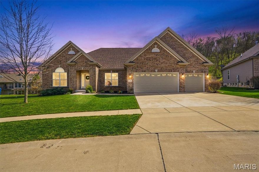 Just steps from Castlewood State Park, this stunning ranch offers 4,572 square feet of beautifully designed living space, tucked away in a quiet wooded valley on a peaceful cul-de-sac. Inside, soaring 9-foot coffered ceilings enhance the open-concept layout, anchored by an impressive great room featuring a dramatic floor-to-ceiling stone fireplace, and a wall of windows that fills the home with natural light. The gourmet kitchen boasts an oversized chef’s island, breakfast bar, double ovens, and abundant workspace. The expansive primary suite is thoughtfully positioned on its own private wing, creating a true retreat complete with a spa-inspired bath and an oversized walk-in closet that conveniently connects to the main-floor laundry. Three additional generously sized bedrooms provide ample space for family and guests alike. The bright, finished 1,700-square-foot lower level expands your living options with a spacious recreation room, additional bedroom, full bath, and additional unfinished space for storage or future expansion. Outdoors, unwind on the custom-designed deck overlooking serene wooded views, a lush lawn, and a fully fenced backyard. Additional highlights include a new roof (2024), sprinkler system, and a custom workshop in the garage.