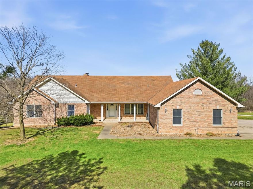 Spacious ranch home situated on 4.99 acres offering a blend of comfort and functionality. The main level features 3 large bedrooms and 2.5 bathrooms, along with a vaulted living room highlighted by a 2 full masonry wood-burning fireplace. The kitchen includes solid surface countertops and is complemented by both a formal dining room and a breakfast area. Main floor laundry adds convenience. The partially finished walk-out basement provides additional living space, including a media room, recreation room, den or potential 4th bedroom, and a full bathroom, along with ample storage space. Outdoor features include a deck off the back of the home and a lower-level patio, ideal for relaxing or entertaining. Additional improvements include a 3-car attached garage and a 25 x 46 shed/barn, offering excellent space for storage, hobbies, or equipment.