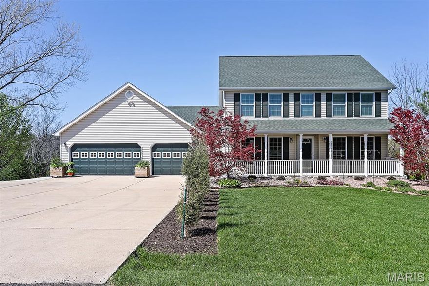 Nestled on 8+ acres, this immaculate two-story home offers the perfect blend of comfort, privacy, and natural beauty. A welcoming front porch that spans the entire length of the home, framed by vibrant flowering perennials, creates a warm first impression and an ideal spot to relax and take in the peaceful surroundings. Inside, the main level features a spacious living room with a cozy gas fireplace, perfect for gathering with family and friends, along with a separate dining room for more formal entertaining. The expanded eat-in kitchen is a chef’s delight, including custom cabinetry, recently installed new wall oven, gas cooktop, quartz countertops, and a generous pantry. Just off the kitchen, a screened-in sunroom offers the perfect place to enjoy fresh air and scenic views throughout the seasons. A large 19’ x 6’ main-floor laundry room with additional storage provides everyday convenience and leads directly to the expansive composite deck, where you can unwind in the 19’ swim spa while overlooking the tranquil property. Upstairs, you’ll find three comfortable bedrooms, including a beautiful primary suite featuring abundant closet space, double vanities, and a luxurious oversized walk-in shower. Two additional bedrooms share a well-appointed hall bath with tub and shower. The walk-out lower level adds even more living space with a fourth bedroom, recreation room, and cozy sitting area. French doors open to a covered patio, offering serene views of the private yard and the approximately five wooded acres that back to picturesque Dunn Spring Creek. Completing the property is a 29’ x 29’ oversized three-car garage, providing plenty of space for vehicles, storage, or hobbies. Thoughtfully designed and meticulously maintained, every detail of this exceptional home reflects quality, comfort, and the beauty of country living—just waiting for you to call it home.