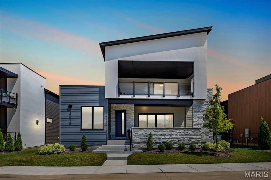 Fantastic, less than 2-year-old home, in the most unique development in St. Louis, Chesterfield Waterfront at Wildhorse Village.  This custom-built 1.5-Story home with an open floor plan is a must-see. 5 Beds, 5 Baths (4F/1H) and over 4,500 sqft of living space, including sunlit open floorplan with 10' ceilings, wide plank flooring, all with incredible lake views.  The amazing outdoor living space is made up of a front lanai with 12' sliding doors, a covered 2nd floor deck, and another 12' sliding door from kitchen opening to the courtyard with stone pavers.  Enter the home from the lanai leading to the entry foyer and separate office, with French doors, opening to the great room with tiled floor-to-ceiling gas fireplace with metal hearth opening to dining room and Kitchen with GE Cafe appliances, solid surface countertops, custom cabinetry, large island with seating.  The main floor primary suite has a spacious walk-in closet and large shower, a separate standalone tub, double vanity with backlit lighting. Additional first floor features include a 1/2 bath and large laundry, and work area.  Open staircase leads to 2nd Floor with 3 Bedrooms, one, a secondary suite, with large en-suite bath, and 2 other bedrooms with large, shared bath, and bonus room that walks out to covered deck with spectacular lake views.  Lower Level has fantastic finished space, and bedroom with full bath. Relax outside in your private oasis. Some remote window treatments, irrigation system, lawn care and landscaping, and 3-car garage. This development is never-before-seen in St. Louis, with walking paths, 2 lakes, premier dining and shopping within minutes, and Easy highway access. This is a lifestyle of unparalleled luxury, comfort, & convenience.