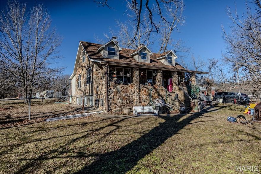 Here's your chance to own a piece of history on 12.95 acres with access to the Niangua River!  The charm of the original Corkery home has stood the test of time and is ready for its new owners!  Offering beautiful views from the large covered porch, potential for over another 1600 square feet of living space, fenced-in yard, multiple outbuildings, hookups for an extra home or RV, and climate-controlled housing for animals!