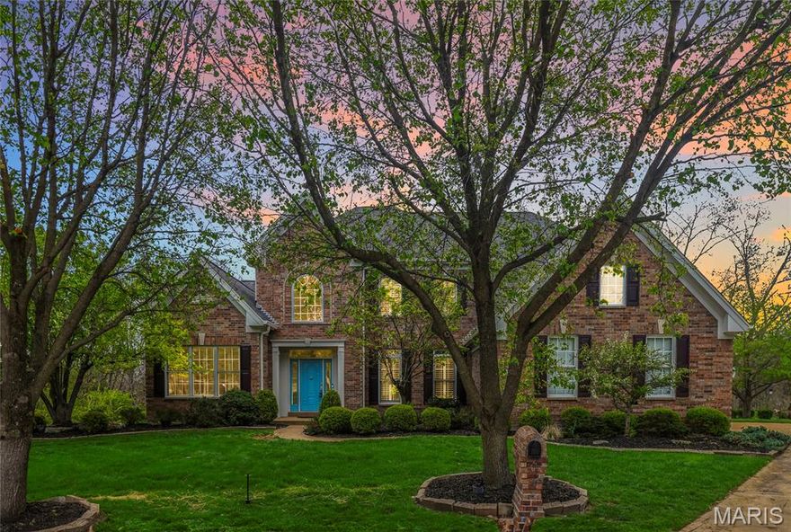 Open Sun, 4/12, 1-3pm. This is West County living at its finest. Tucked away in the Wynncrest neighborhood on a quiet cul-de-sac and backing to woods, this 5-bedroom, 6-bath home offers nearly 7,000 sq ft of thoughtfully designed living space with a rare sense of privacy.

A stunning elevation welcomes you into a soaring foyer, flanked by a formal dining room and private study. Just beyond, the sun-drenched two-story great room makes an immediate impression with gleaming hardwood floors, a beautiful fireplace, and a wall of windows that brings the outdoors in.

The kitchen is designed for both everyday living and entertaining, featuring granite countertops, stainless steel appliances, custom cabinetry, and abundant workspace. An oversized breakfast area flows seamlessly into the hearth room, creating a warm and functional gathering space. A convenient half bath and main floor laundry are just steps away.

The main-floor primary suite offers a true retreat with its high ceilings, spacious walk-in closet, and beautifully appointed bath. Upstairs, you’ll find three generously sized bedrooms, two full baths, and a versatile loft space.
The finished 9 ft pour lower level expands your living space with a full bar, theater area, additional bedroom, and plenty of room for recreation, hobbies, or guests.

Step outside to a private, park-like backyard surrounded by mature trees. A stone patio and tucked-away fire pit in the woods create a setting that feels both peaceful and memorable.

Additional highlights include a new roof (2025), new water heaters (2026), 3-car garage, full gym space, and a location close to everyday amenities.

If you’re looking for space, privacy, and a home that truly lives well, this is one worth seeing.