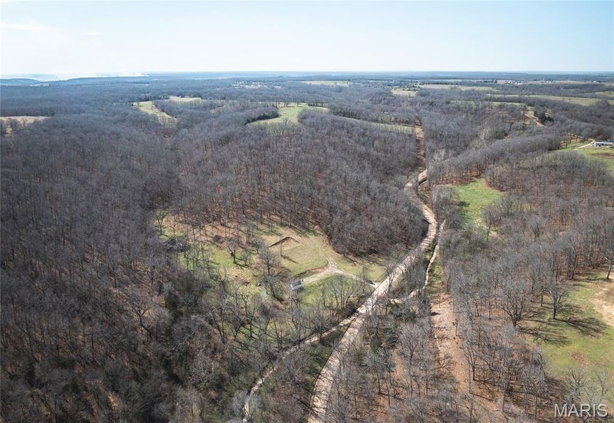 If you’ve ever dreamed of stepping out your back door and into your own private hunting paradise, this is the opportunity you’ve been waiting for. This stunning 40-acre tract offers the perfect blend of seclusion, natural beauty, and prime wildlife habitat—properties like this are hard to find and even harder to replace. The land features a diverse landscape of rolling terrain, mature timber, natural draws, and water features that create ideal travel corridors for deer and turkey. Whether you’re an avid hunter or simply enjoy the outdoors, this property is perfectly suited for recreation and long-term enjoyment. What truly sets this property apart is the infrastructure already in place. Unlike many raw recreational tracts, this one is ready to use from day one, with electric, water, septic, and an established camper setup already on site. A newer 12x16 outbuilding provides convenient storage for equipment and gear, making it an excellent turnkey hunting retreat or future homesite. Property Highlights: 40 surveyed acres, electric, water, and septic already installed, multiple established build sites, newer 12x16 outbuilding for storage or equipment, ATV trails throughout the property, natural spring, small cave, and diverse terrain, excellent deer and turkey hunting with natural funnels and bedding areas, maintained gravel road access and convenient location less than 20 minutes from I-44. Priced at $209,900 (approximately $5,247 per acre), this property stands out as a strong value for acreage with utilities already in place. Whether you’re looking for a private hunting getaway, a recreational retreat, or the perfect place to build your future home surrounded by nature, this property offers the flexibility to make it your own.