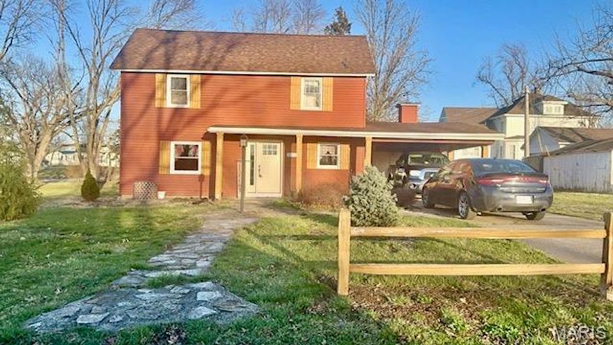 Spring is just around the corner and Mark Twain Lake will be ready for all your summer activities! Boating, fishing, swimming! It’s all waiting for you. Need a place to stay while you are there? Why not own a little piece of Perry MO! This property is great for a summer home, an air BNB or if you want, a full-time residence. This was the currents owners first home together but life is taking them on a new adventure so here’s your chance. There are 2 bedrooms on the upper level with a full bath. The main level has a living room with a beautiful fireplace, a dining room, kitchen, half bath and laundry.  There is an attached carport along with an enclosed area for storage. The back yard has a large patio for evening entertaining, a large side yard for the family to enjoy, a strawberry patch, lots of flowers, a garden shed large enough for your riding lawn mower. A split rail cedar fence around part of the property really sets off the large yard. Just move right in and call it yours! Some information received from the previous owner when it was purchased in 2024 was that there is an updated water heater, new cedar shutters, the new cedar fence, roof replaced in 2022, new flooring, exterior doors, porch lights, and AC unit in 2023/24. Perry is a small community with a big heart. You’ll find quaint shops, a grocery store, parks, year-round events, a bank, insurance company, a lumber yard/hardware store…all the things! Make time to visit Perry, Mark Twain Lake, and this home that is waiting for you and your family to call it yours!