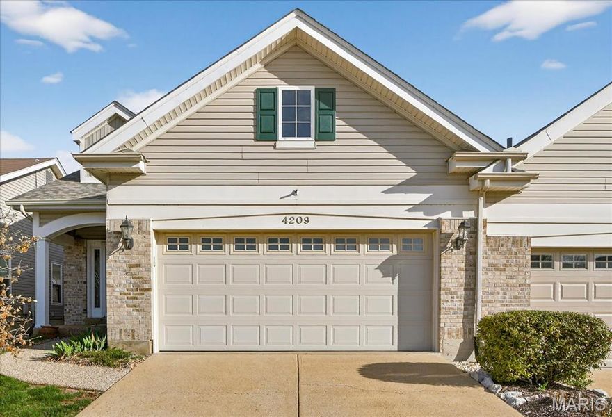 Welcome to 4209 Consett—a charming 1.5-story villa blending comfort, style, and modern updates. This 2-bedroom, 2.5-bath home features vaulted ceilings, hardwood floors, and abundant natural light. The main floor primary suite offers a walk-in closet, bay window, ceiling fan, and a luxurious en-suite with a clawfoot tub and chandelier. The updated kitchen, complete with included appliances, is perfect for any home chef. Adjacent to the kitchen, a cozy breakfast room with a bay window invites you to enjoy your morning coffee while overlooking the patio, seamlessly connecting indoor and outdoor living. Plus, the convenience of a main floor laundry room makes everyday living a breeze. Upstairs, you’ll find a spacious second bedroom with its own full bath and a versatile loft area ideal for a home office or reading nook. Outside, the level patio creates the perfect space for entertaining or unwinding as the sun sets. Additional highlights include a full, unfinished lower level, oversized 2-car garage, built-in beam vacuum system, and included washer and dryer for move-in ease.