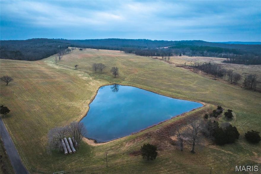 Exceptionally clean 91.5± acre turnkey cattle farm offering productive ground, income potential, and a stocked lake—ready to use from day one. Recently surveyed and fully fenced with new 5-strand barbed wire, including cross fencing. Nearly every acre is usable for grazing or hay production, with over 300 large round bales produced last season. A spring-fed creek provides reliable year-round water for livestock.

The property features a well-maintained 3± acre stocked lake with bass and crappie, adding both functional water access and outstanding recreational value. Improvements include a dry antique barn with capacity for approximately 180 round bales plus equipment storage, a calving shed, and an additional storage shed.

A charming 2-bedroom, 1-bath farmhouse is currently rented, offering immediate income or the option for owner occupancy. The land is nearly flat with gentle elevation changes that create incredible west-facing views overlooking pasture and lake. Electric runs across the property at the hilltop, making it an ideal future homesite.

Nearly a half mile of paved road frontage provides easy access. Conveniently located just 12 minutes from Potosi and just over an hour from St. Louis. Excellent long-term potential for a multi-home estate, family retreat, or shared ownership property. Deer and turkey are abundant, with trophy bucks harvested.

Call today to schedule a private tour.