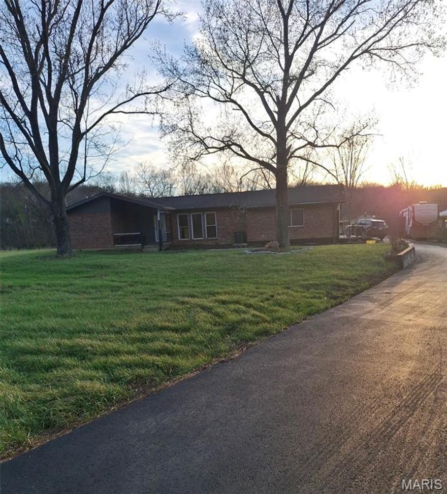 A little piece of paradise just needing your finishing touches.....Full-brick ranch situated on nearly 3.5 level, usable acres featuring a scenic pond—ideal for those seeking space, privacy, and long-term value.

The main level offers a functional layout with a spacious Living Room, separate Dining Room, and a bright, open Kitchen complete with abundant custom cabinetry, gas range, dishwasher, and 3-door stainless refrigerator, plus room for casual dining.

One extra large Master Bedroom and a full bath with soaking tub are located just off the kitchen. The home also features two screened-in porches—a welcoming front porch and a larger rear porch—both overlooking the expansive property and tranquil pond.

Additional highlights include a walk-up basement offering strong potential for added living space or storage, a recently replaced garage door, and a 30x60 outbuilding with concrete floor and overhead door—perfect for equipment, workshop use, or future income-producing possibilities.

With solid construction, usable acreage, and multiple value-add opportunities, this property is well-positioned for investors, renovators, or buyers looking to create their own vision.