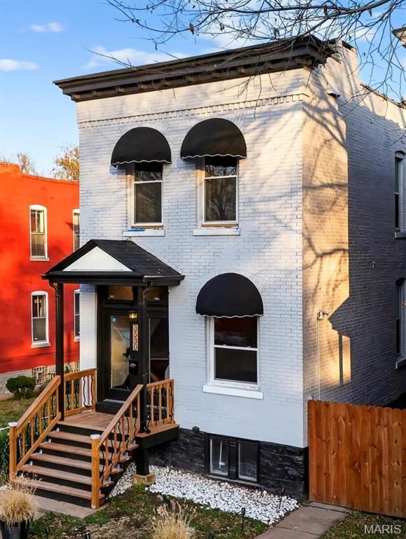 View of front of house with brick siding