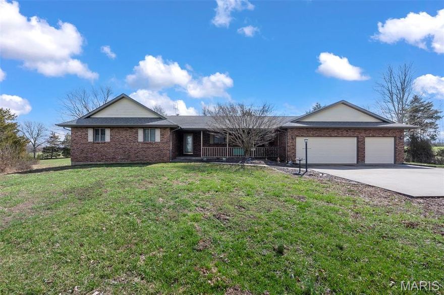 Escape to your own private retreat on 3.65 acres, tucked off the road for peaceful country living. This custom-built ranch blends warmth, space, and thoughtful design throughout. The primary suite feels like a getaway of its own, featuring a cozy sitting area with fireplace, spa-like bath with jacuzzi tub and separate shower, walk-in closet, and direct access to the deck. The inviting living room offers a fireplace and seamless deck access create the perfect setting for relaxing or entertaining. The kitchen is designed for gathering, offering a working island with cooktop, breakfast bar, an abundance of cabinets, an adjoining dining area, plus a separate formal dining room. A split-bedroom layout, main-level laundry, and generous storage add everyday comfort and convenience. The finished basement provides flexible space for entertaining with a large open area, wet bar, and half bath. There’s still plenty of storage downstairs and a cedar-lined closet. Geothermal heating and cooling, central vacuum, and a water softener add efficiency and ease. Outside, two sheds and open acreage offer room for hobbies and outdoor enjoyment. If you’re looking for privacy, comfort, and room to breathe, this one delivers.