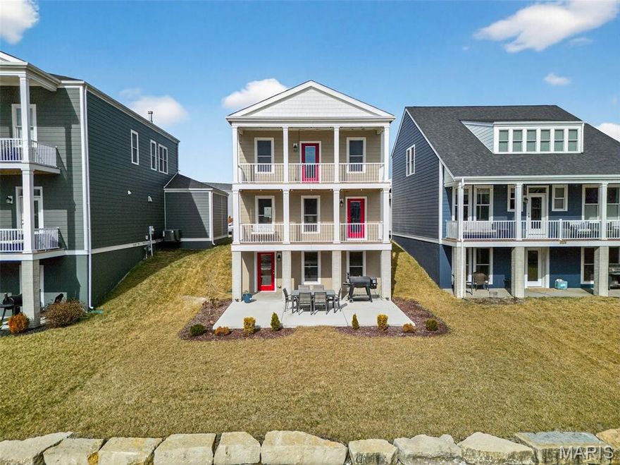 Welcome to 121 Tiber Way in the highly desirable New Town community of St. Charles!

This beautifully maintained 3 story home blends timeless charm with modern style and peaceful canal views. The light filled main level features an open concept layout with beautiful flooring and designer touches throughout. The stunning kitchen offers crisp white cabinetry, sleek hardware, stainless steel appliances, a striking backsplash, and a large center island perfect for gathering with family and friends. The spacious living area is warm and inviting, filled with natural light from oversized windows.

Step outside and enjoy two levels of covered decks, creating the perfect setting for morning coffee or relaxing evenings overlooking the canal. The finished walkout basement adds exceptional living space and opens to a private patio and backyard retreat backing directly to the water, ideal for entertaining or unwinding at the end of the day.

Move in ready and thoughtfully designed, this home offers comfort, beauty, and the charming lifestyle New Town is known for. A true gem you do not want to miss!