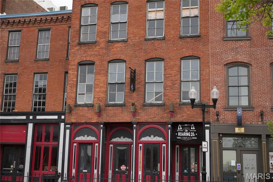 The Feather Building is one of 17 historic buildings in Laclede's Landing and offers versatile space for a variety of uses. Built in 1885, it was originally used for the manufacturing and distribution of wagon wheel grease and later for motor oil for Model T vehicles. This three-story brick building encompasses approximately 18,850 square feet, with each floor covering around 6,283 square feet.

The Feather Building features two entrances on North 2nd Street, along with an additional entrance on the second floor from Collins Alley. Most recently, the second floor was home to "The Royal Dump" Dinner Theater, while the first floor housed "The Roaring 20's Complex," a dueling piano bar. 

The building is equipped with an elevator, enhancing accessibility. It presents an excellent opportunity to own a multi-tenant venue that has previously accommodated four bars across three floors, featuring three stages—one on each floor—as well as a prep kitchen. Location: City, Downtown