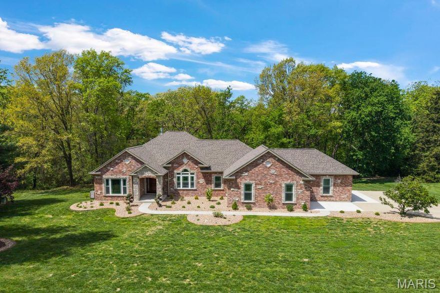 PREPARE TO BE IMPRESSED...Newly constructed, this gorgeous Atrium Ranch is situated on 1.53 Acres with over 4,200SF of Finished Living Space, providing 4 Bedrooms, 3 Full Baths & Side-Entry 3-Car Garage...YOUR OWN PERSONAL OASIS * The Brick & Stone Front Exterior welcomes you to step inside and FALL IN LOVE...an open floorplan with 9' Ceilings and Luxury Vinyl Plank floors that flow throughout most of the Main Level * ARCHED Opening from Entry Foyer in to Dining Room, highlighted by Tray Ceiling, and Den that offers a perfect Space for Home Office or other flexible uses * Floor-to-Ceiling Stone Fireplace with Raised Hearth & Wood Mantle are the focal point of this VAULTED Great Room with Atrium & Open Staircase to Lower Level * Any Home Chef with LOVE this custom designed Kitchen...42" Cherry Cabinets, Stone Arched Opening features 5-Burner Gas Cooktop, Built-In Double Ovens, Under Counter Microwave, 10'+ Center Island with Wrap-Around Seating for 6+, QUARTZ Counters & Tile Backsplash and Walk-In Pantry * Hearth Room with Gas Fireplace, could also serve as a Breakfast Area, opens to Composite Deck & Aluminum Railings * SPLIT BEDROOM FLOORPLAN features OVERSIZED Primary Bedroom with Dual Walk-In Closets and SPA-LIKE Ensuite Bath including Double Bowl Floating Vanity with Storage Towers & Hidden Electric and Storage for your Styling Tools, OVERSIZED Shower & Freestanding Soaking Tub * Two Additional Bedrooms, Hall Bath & Laundry/Mud Room with Wash Sink & Built-In Cubbies complete the Main Level * This Lower Level is an ENTERTAINER'S DREAM, featuring a Custom Stone & Quartz Bar with Wine Cooler & Space for Full-Size Refrigerator, Media Area & Game Area, PLUS 4th Bedroom, Steam Shower Bath, Exercise Room and still plenty of STORAGE that can also be accessed from exterior with Double-Door Entry * And, all of this is just a short GOLF CART RIDE into DOWNTOWN COTTLEVILLE...SCHEDULE YOUR APPOINTMENT TODAY!
