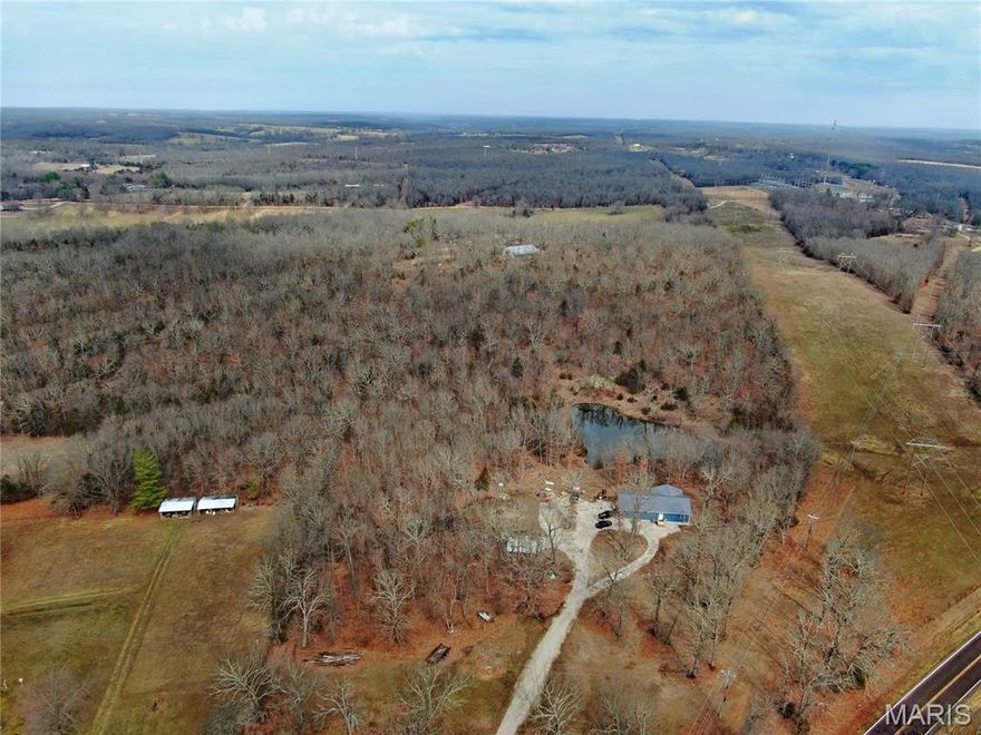 SELLER IS READY TO MOVE, WILL CONSIDER SERIOUS OFFERS. Welcome to your private countryside retreat! Built in 2022, this property features one level living, and offers the perfect blend of modern comfort and peaceful rural living. Situated to take advantage of the scenery, the home overlooks a fully stocked pond, creating a relaxing backdrop you can enjoy year-round. The property provides excellent privacy, making it an ideal escape from the noise and pace of town while still offering convenient access to nearby amenities.
Inside, the home features comfortable one-level living, perfect for easy maintenance and everyday convenience. Despite the home's modern construction, it includes distinctive touches such as a custom antique vanity and antique cabinetry that add warmth and character. Whether you’re looking for a full-time residence, weekend getaway, or hunting retreat, this property is designed for simple, functional living. A standout feature is the attached oversized 900+ sq ft garage, offering plenty of space for vehicles, equipment, or a workshop area for hobbies and projects. Outdoor features make this property even more versatile. A dedicated concrete pad with electric hookups for a camper or RV provides additional flexibility for guests or travel enthusiasts. The land itself offers a great mix of open pasture and wooded ground, making it well-suited for a variety of uses. The pasture area is ideal for livestock, while the surrounding woods provide excellent habitat for wildlife, creating strong potential for hunting or outdoor recreation right on your own property. Whether you’re dreaming of a hobby farm, hunting property, or simply a quiet place to enjoy nature, this unique property offers the space, privacy, and flexibility to make it your own.