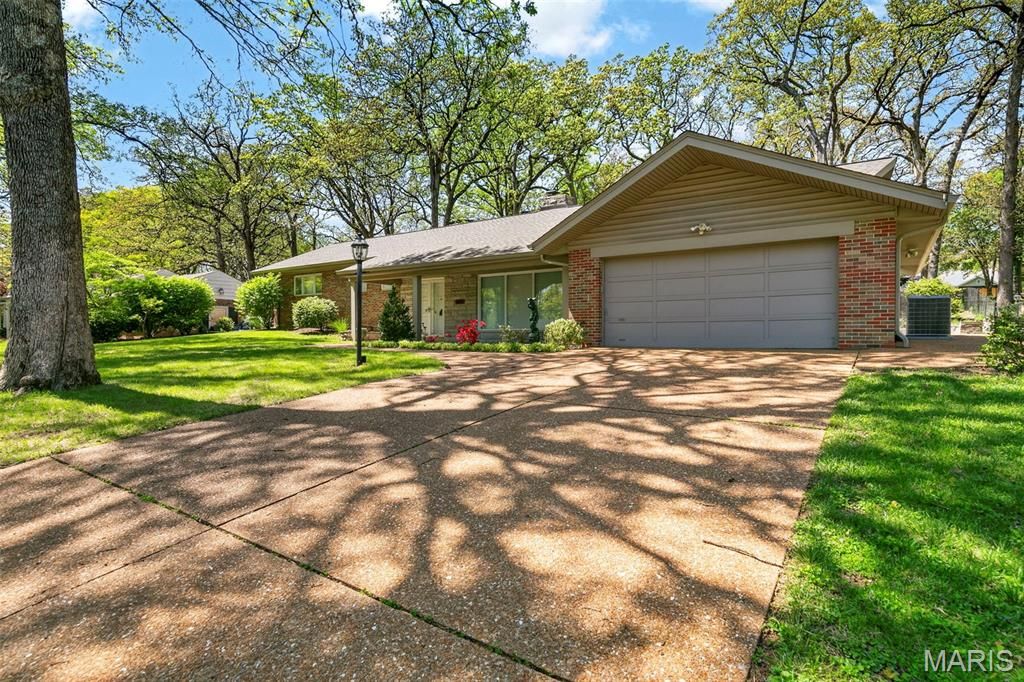 Photo of 8827 Rock Forest Drive, Grantwood Village, MO 63123 (MLS # 26024221)